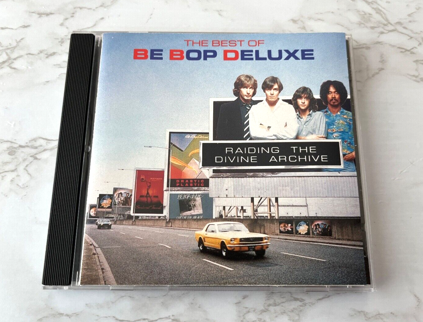 Be Bop Deluxe – Raiding The Divine Archive (1990)