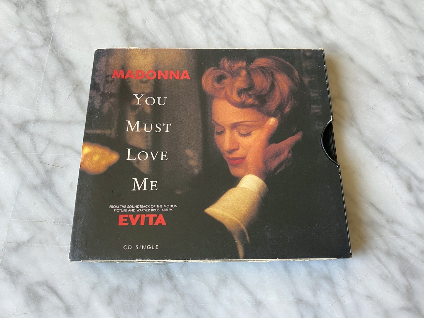 Madonna – You Must Love Me (1996)