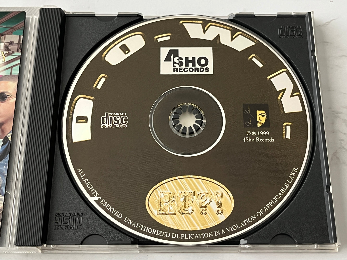 D.O.W.N. (Doing Only What's Necessary) – Ru?! (2000)