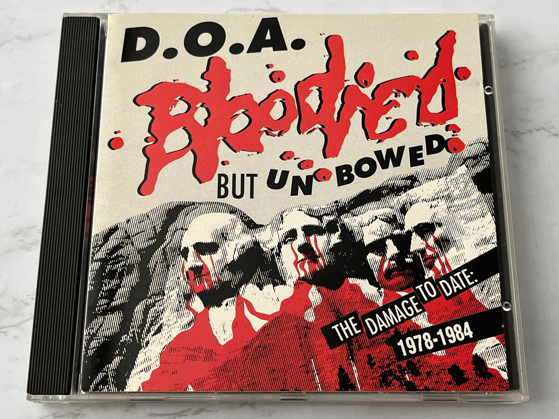 D.O.A. – Bloodied But Unbowed / War On 45 (1992) [CANADA PRESS]