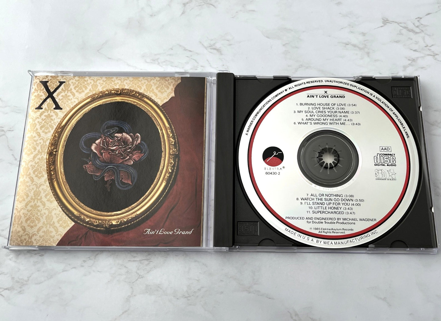 X – Ain't Love Grand [SRC PRESS]