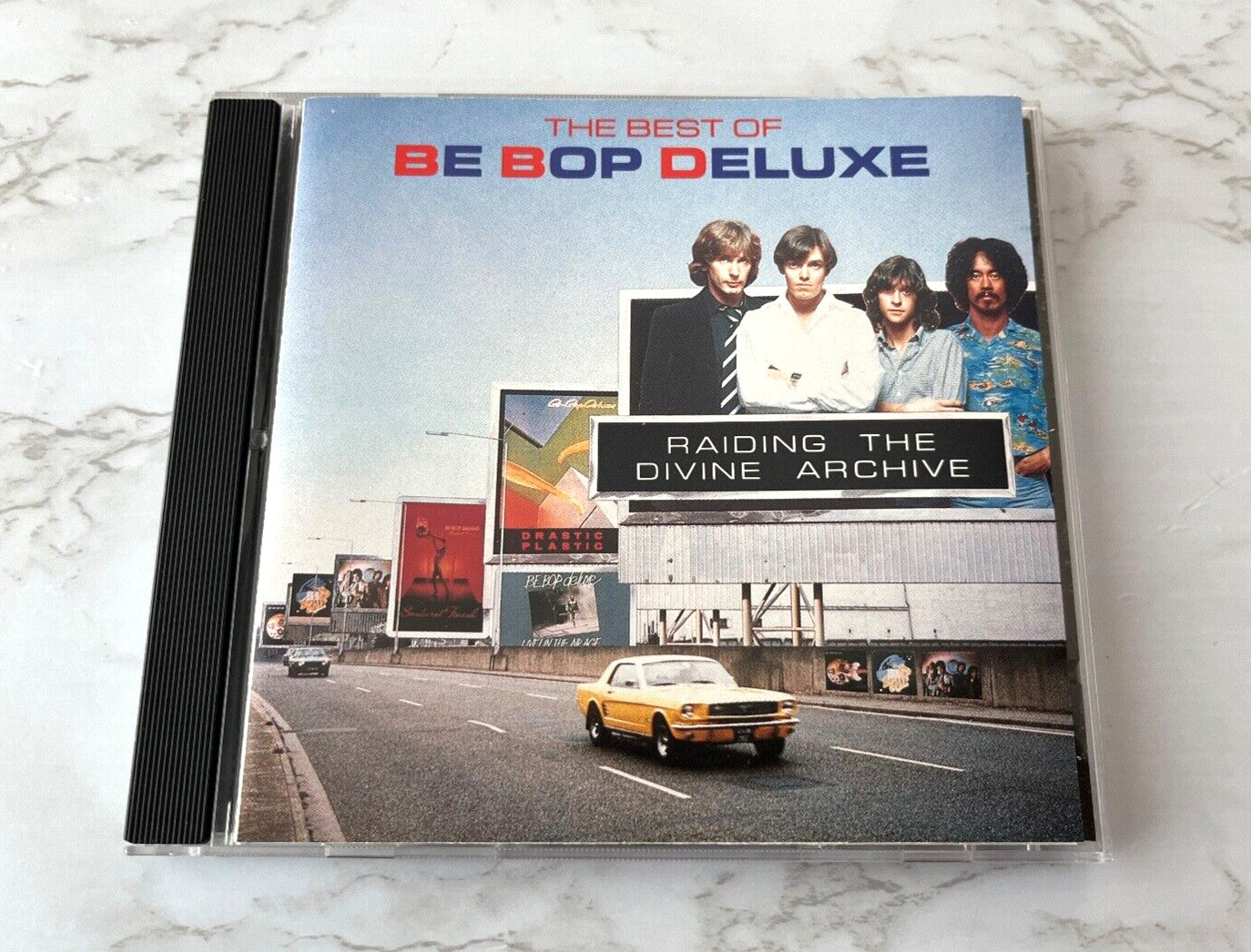 Be Bop Deluxe – Raiding The Divine Archive (1990) [ORIGINAL USA PRESS]