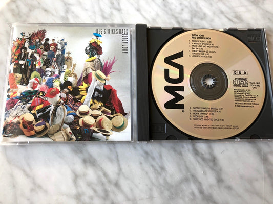 Elton John – Reg Strikes Back [DADC PRESS]