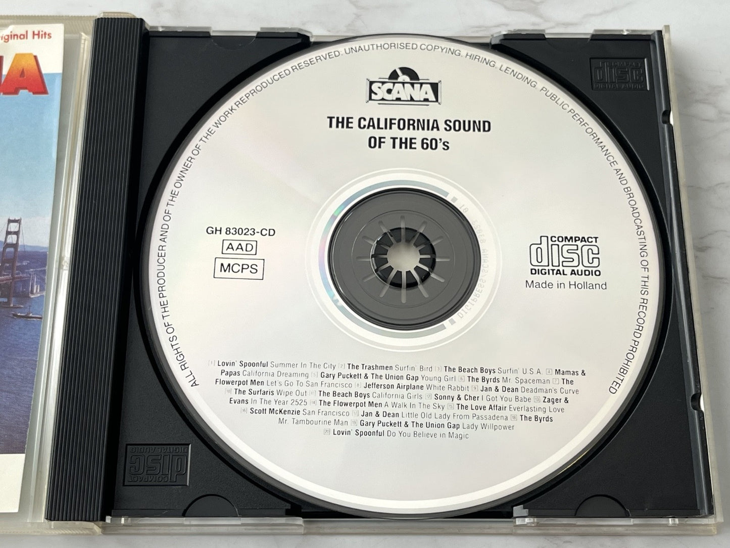 Sonny & Cher, The Beach Boys, The Mamas & the Papas, Various, The Trashmen – The California Sound Of The 60's (1988) [ORIGINAL HOLLAND PRESS]
