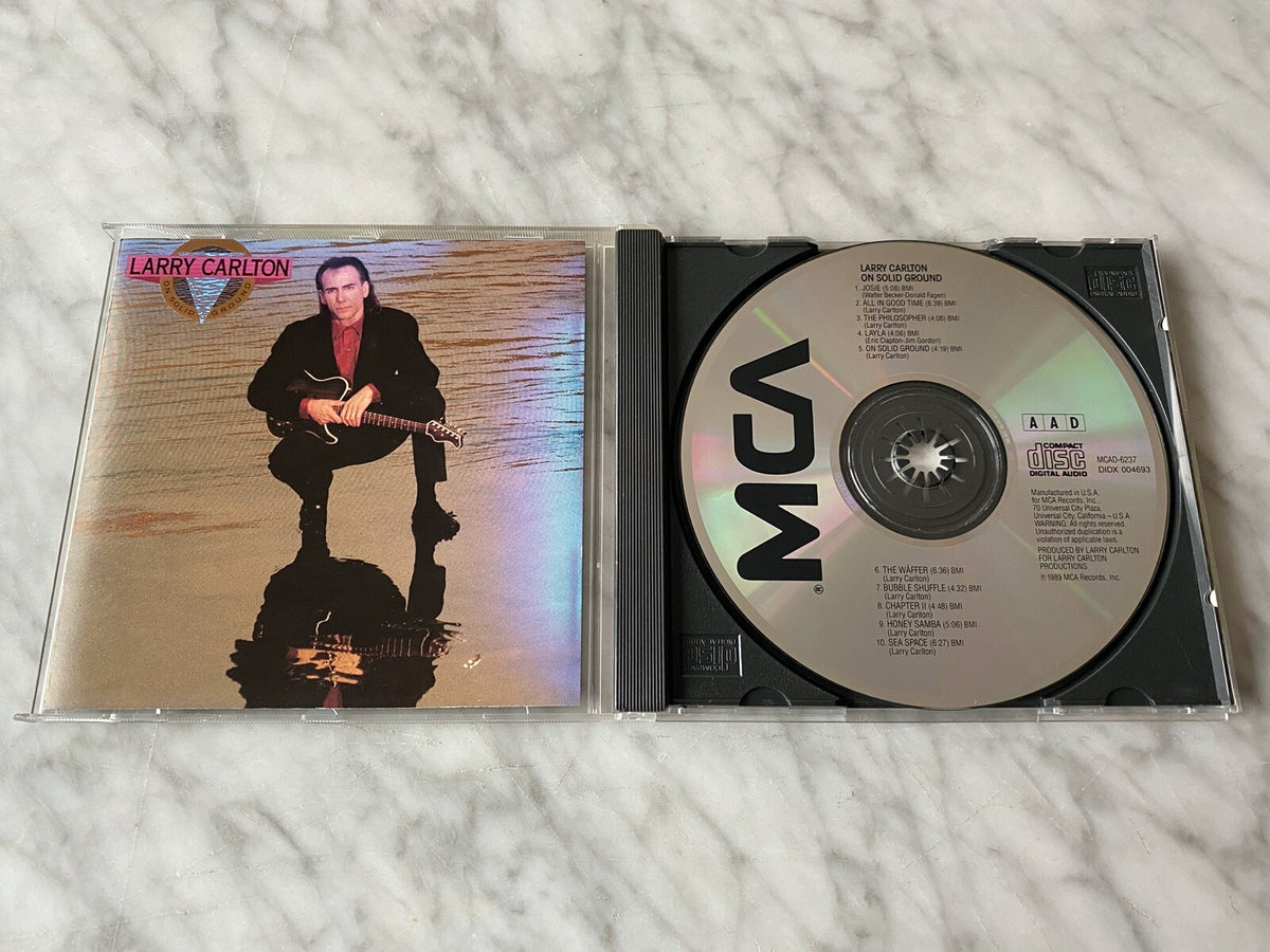 Larry Carlton – On Solid Ground (1989) [ORIGINAL USA PRESS]