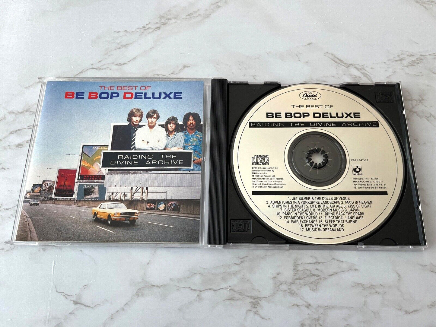 Be Bop Deluxe – Raiding The Divine Archive (1990) [ORIGINAL USA PRESS]