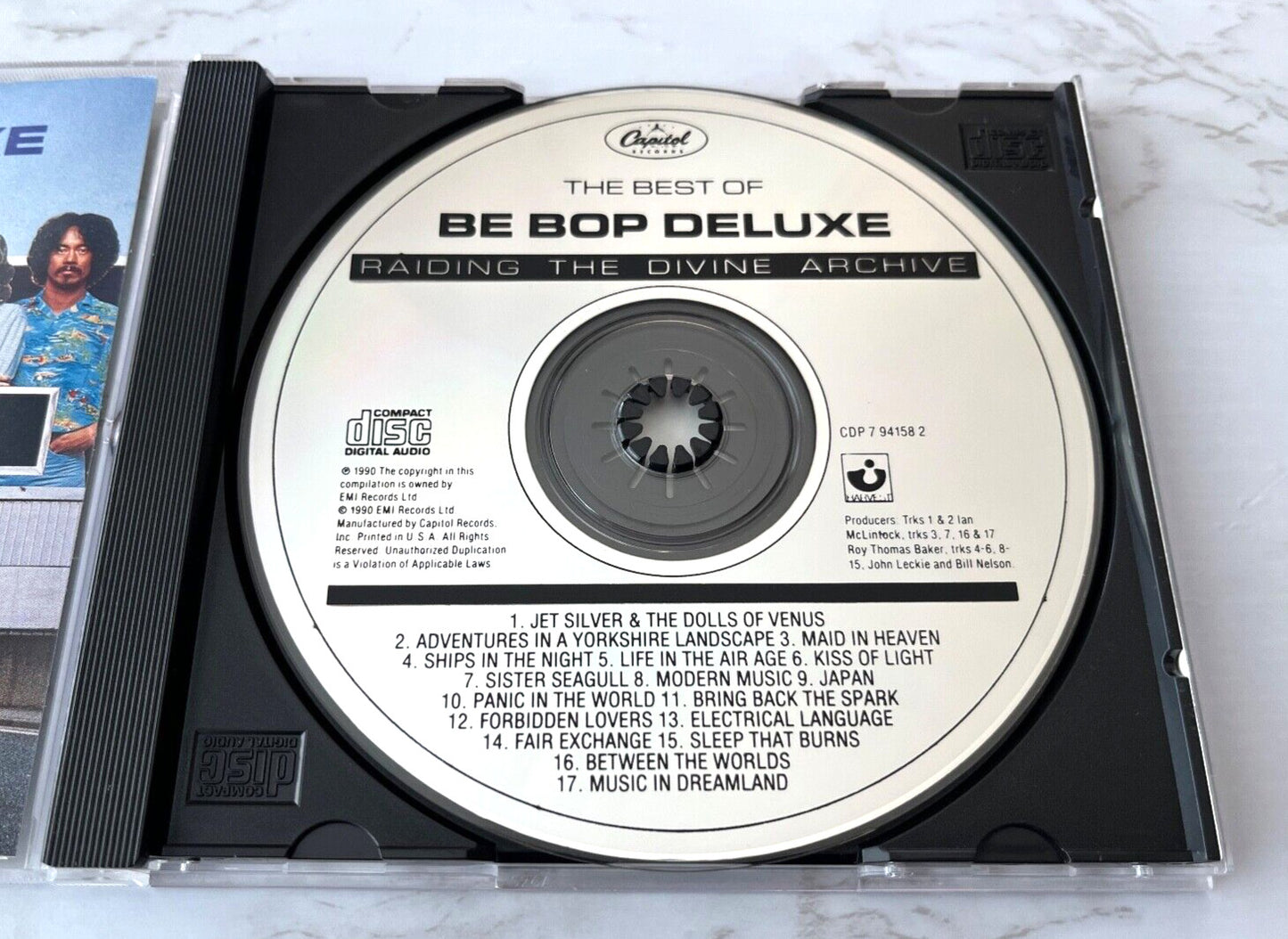 Be Bop Deluxe – Raiding The Divine Archive (1990) [ORIGINAL USA PRESS]